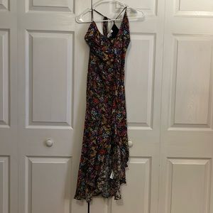 Floral, flowey high low dress. The brand is Lost and Wander.